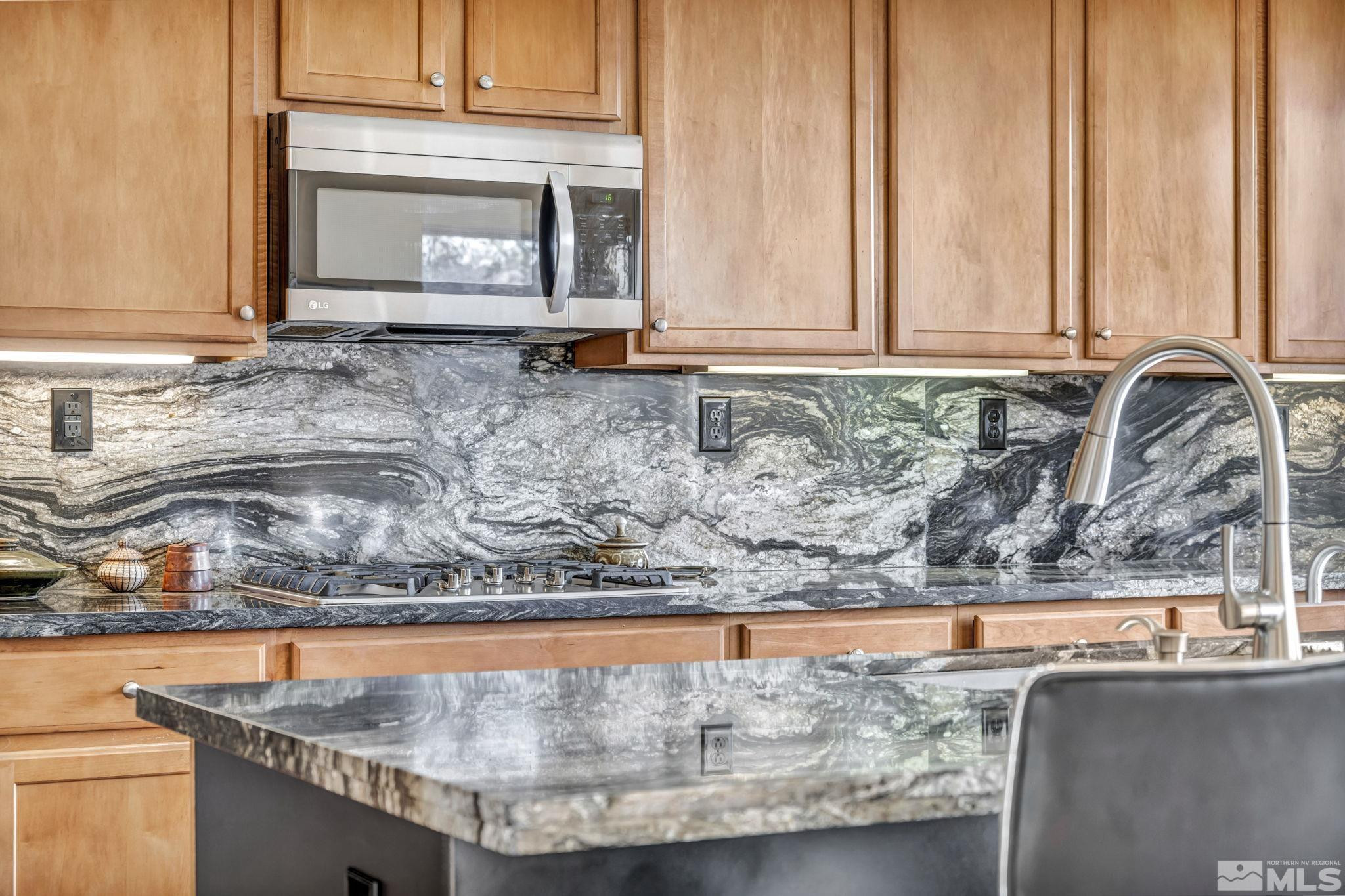 10655 Autumn Walk Lane Reno, NV 89521 - Photo 6 of 40 a view of a living room with a fireplace and a window