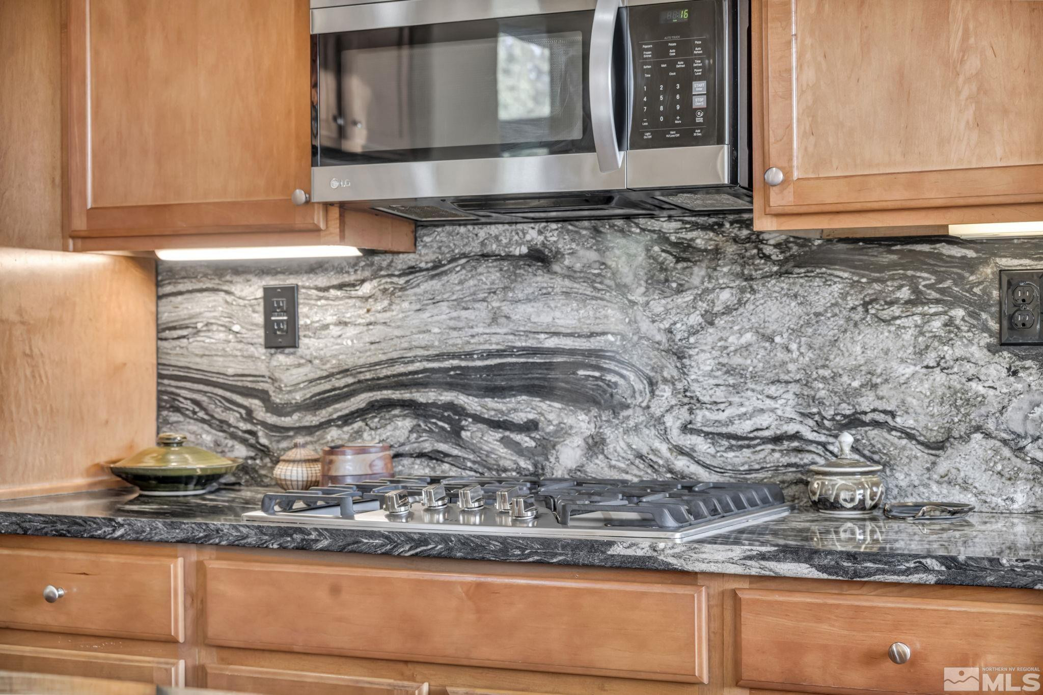 10655 Autumn Walk Lane Reno, NV 89521 - Photo 7 of 40 a view of a kitchen with a sink a window and cabinets