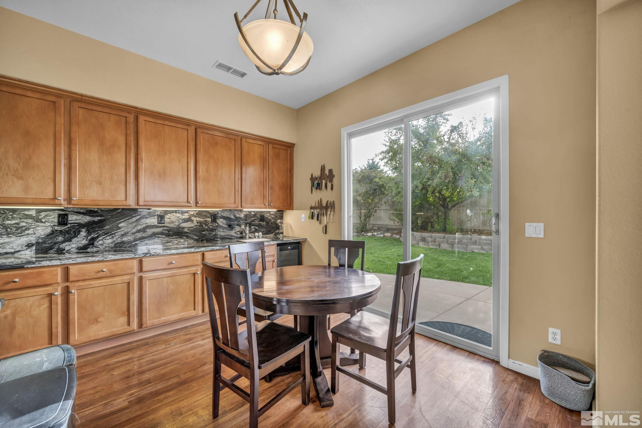 10655 Autumn Walk Lane Reno, NV 89521 - Photo 10 of 40 a view of a dining room with furniture window and wooden floor