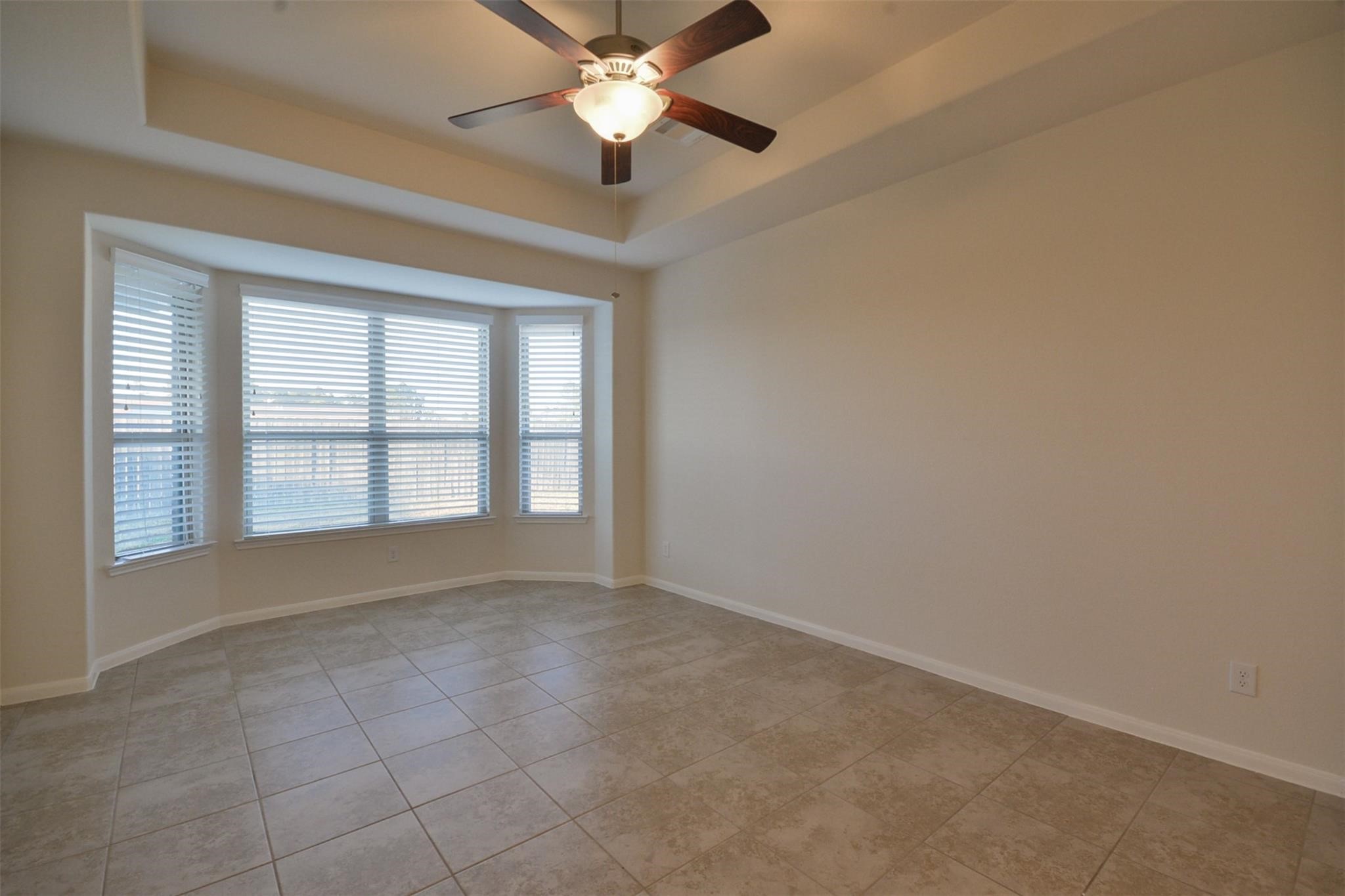3643 Cottage Pines Lane Spring, TX 77386 - Photo 17 of 33 an empty room with chandelier fan and windows
