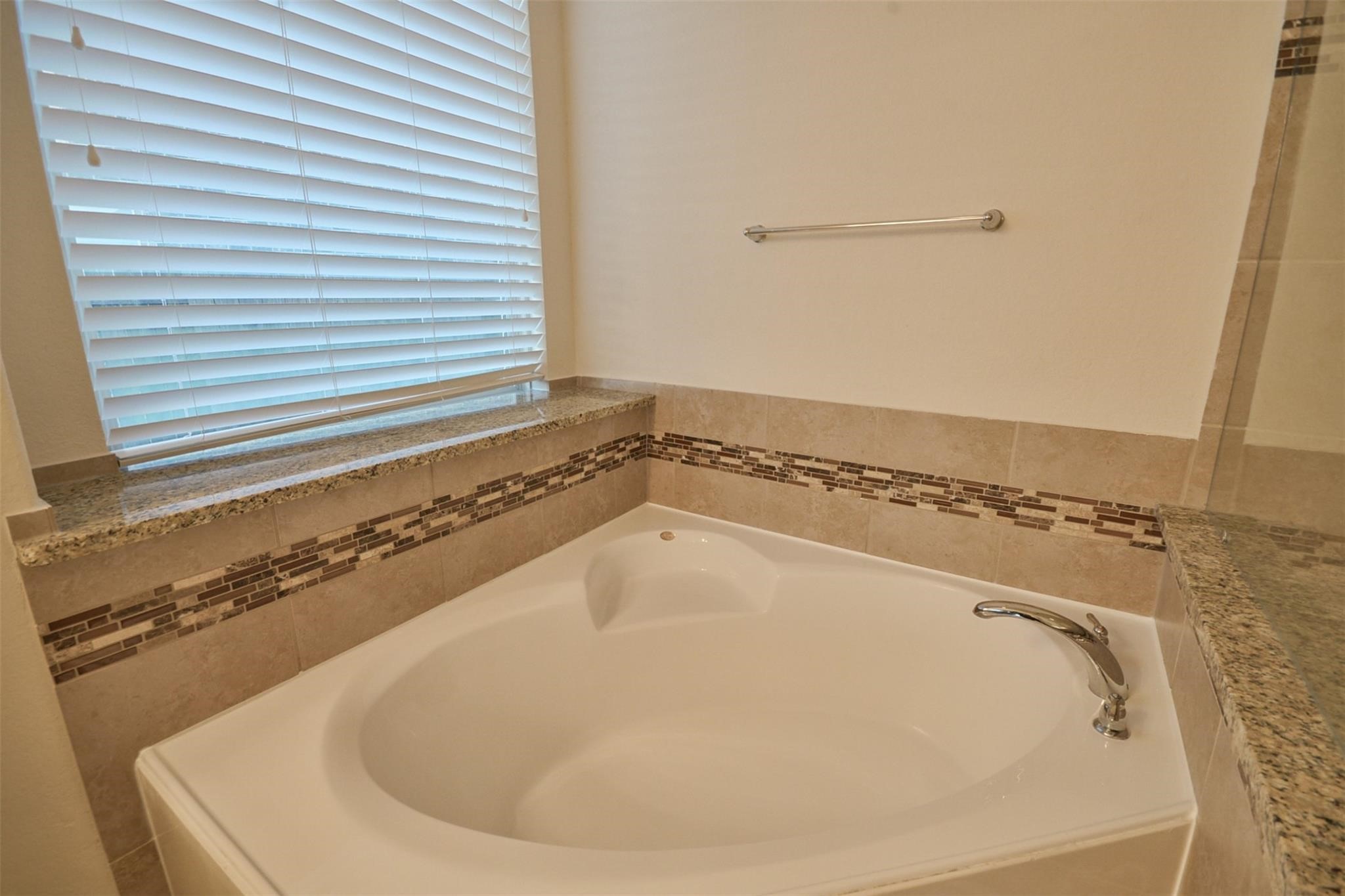 3643 Cottage Pines Lane Spring, TX 77386 - Photo 20 of 33 a bathroom with a bathtub and a window