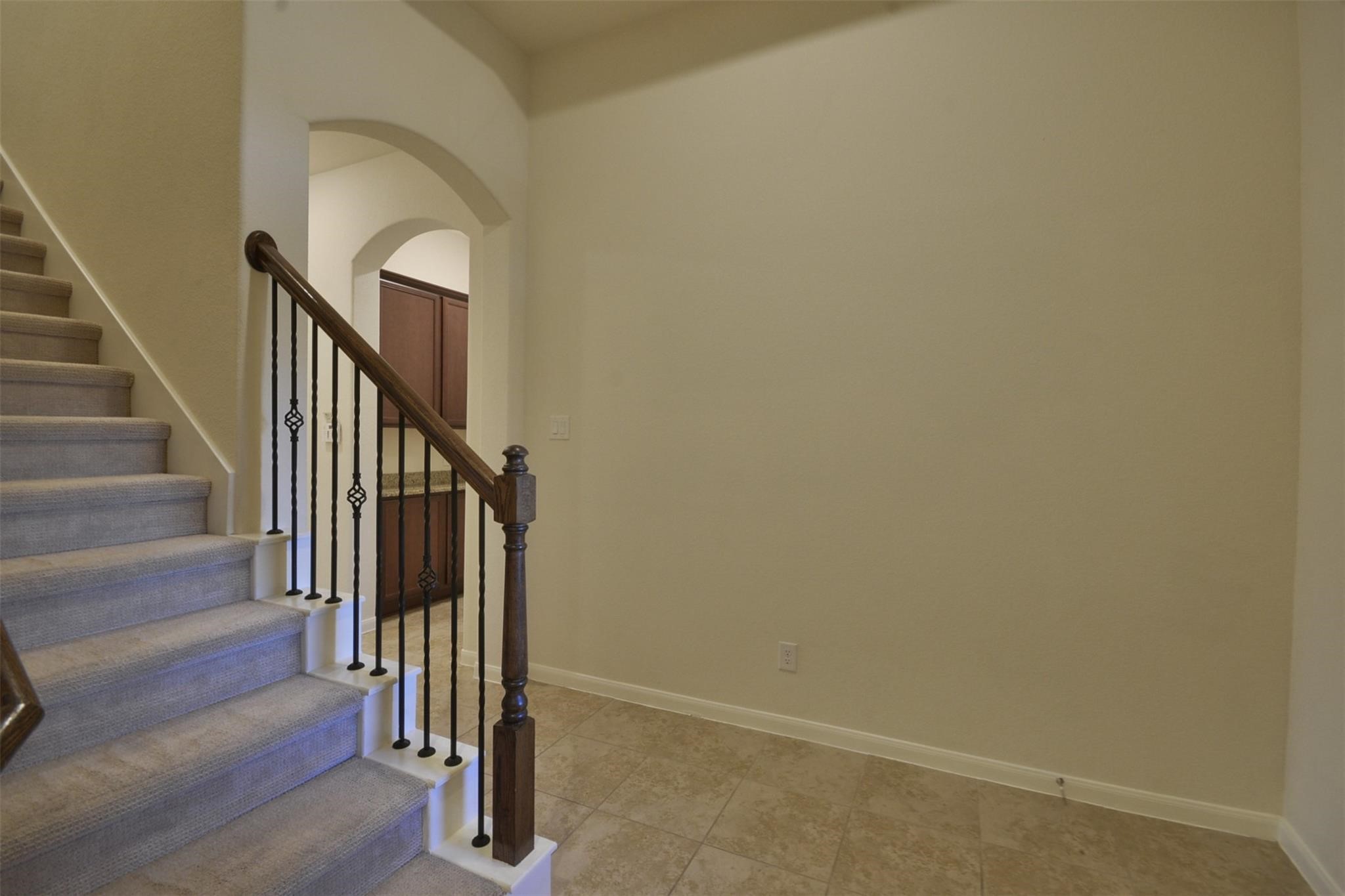 3643 Cottage Pines Lane Spring, TX 77386 - Photo 5 of 33 a view of staircase with wooden floor and white walls