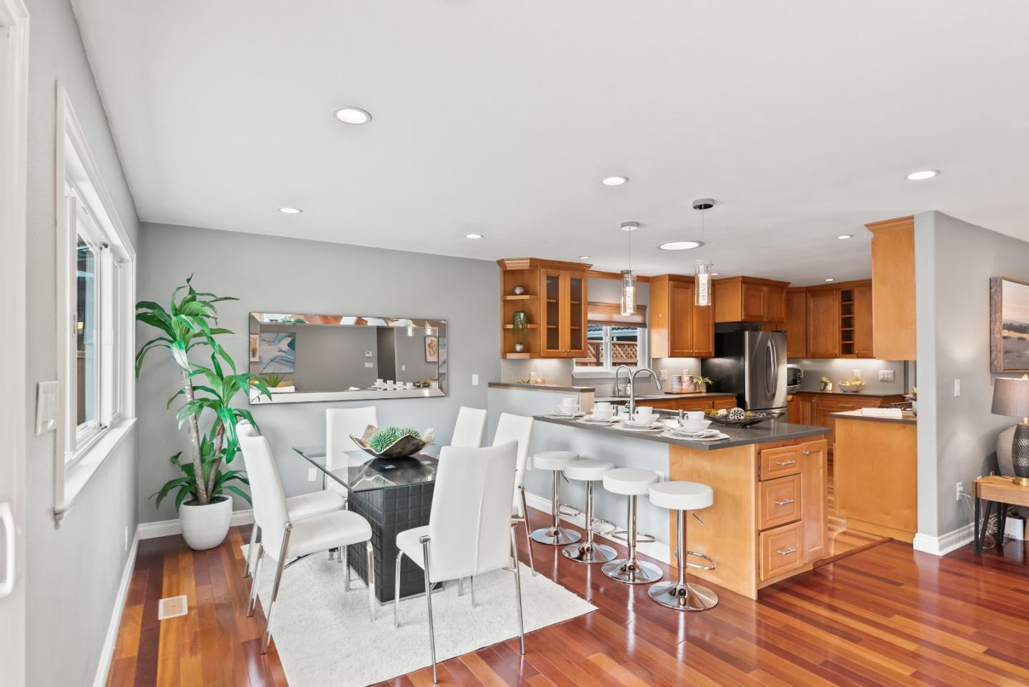 1110 Castleton Way Sunnyvale, CA 94087 - Photo 11 of 27 a living room with stainless steel appliances furniture dining table and a potted plant