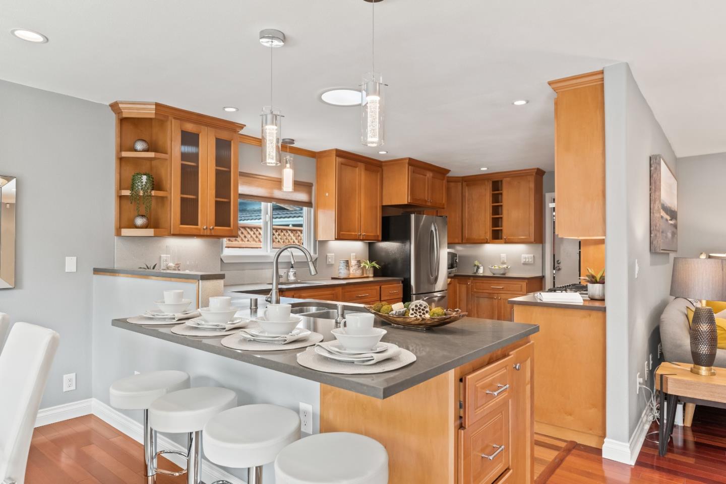 1110 Castleton Way Sunnyvale, CA 94087 - Photo 13 of 27 a kitchen with stainless steel appliances kitchen island granite countertop a sink and cabinets