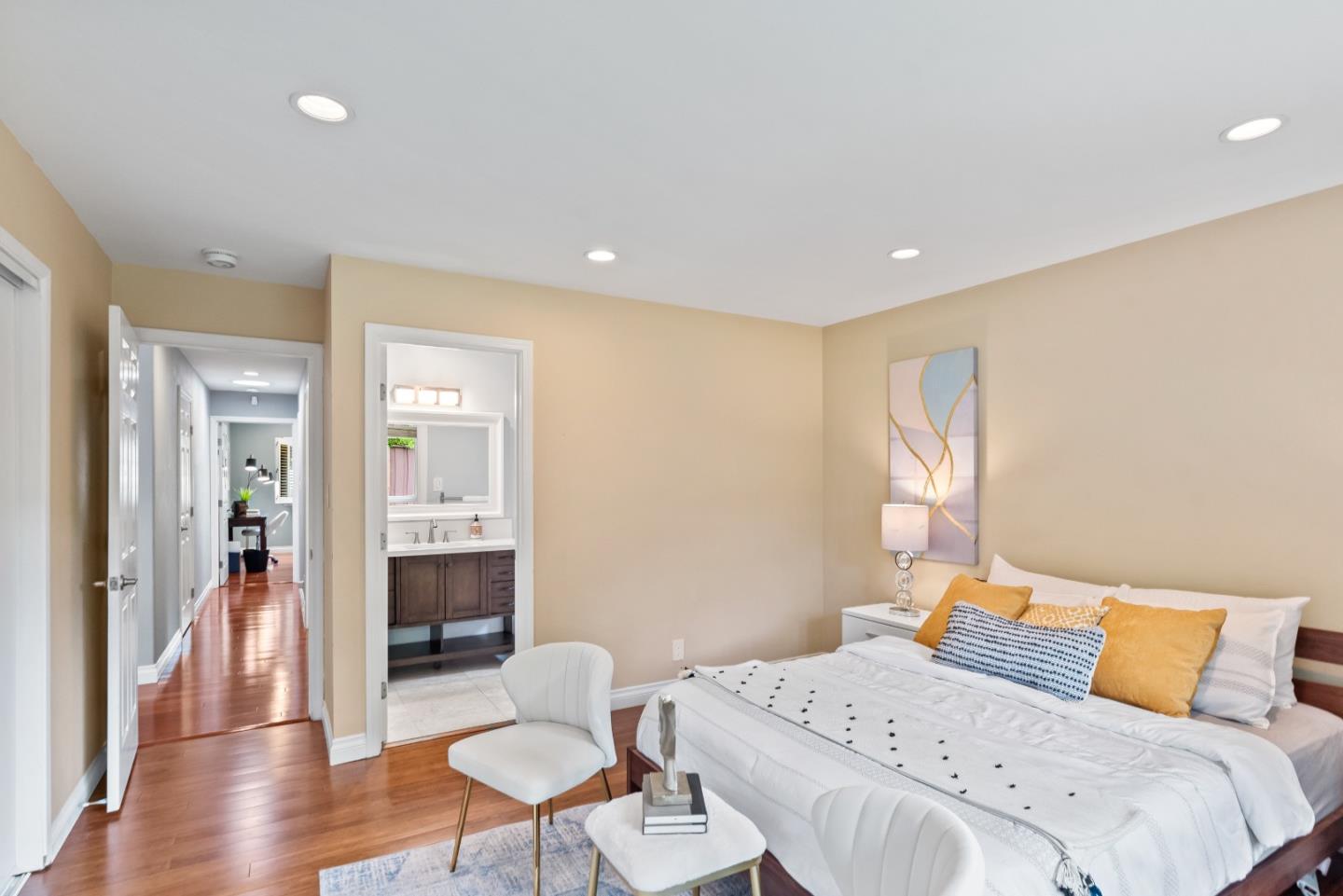 1110 Castleton Way Sunnyvale, CA 94087 - Photo 18 of 27 a bedroom with a bed and wooden floor