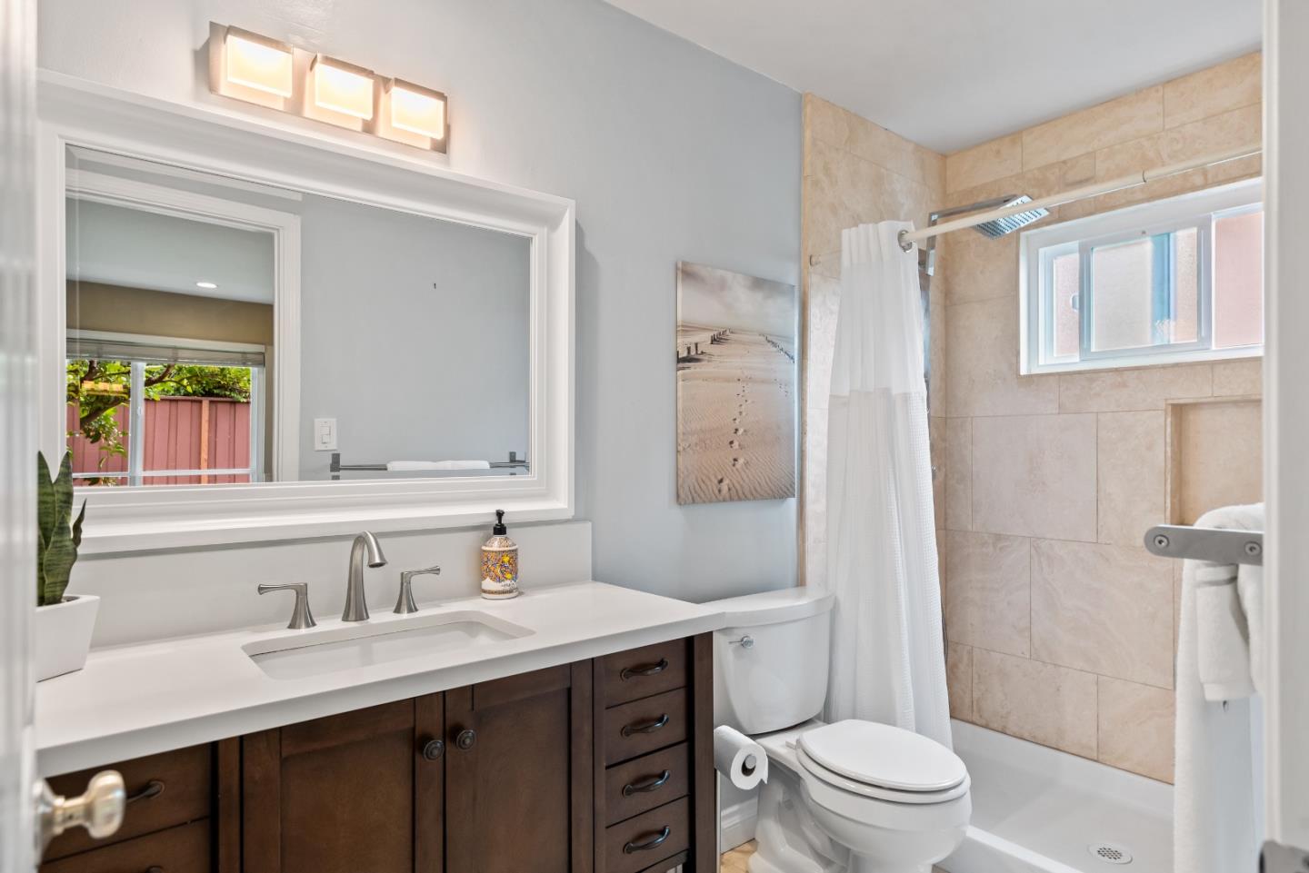 1110 Castleton Way Sunnyvale, CA 94087 - Photo 19 of 27 a bathroom with a sink a toilet a mirror a vanity and shower