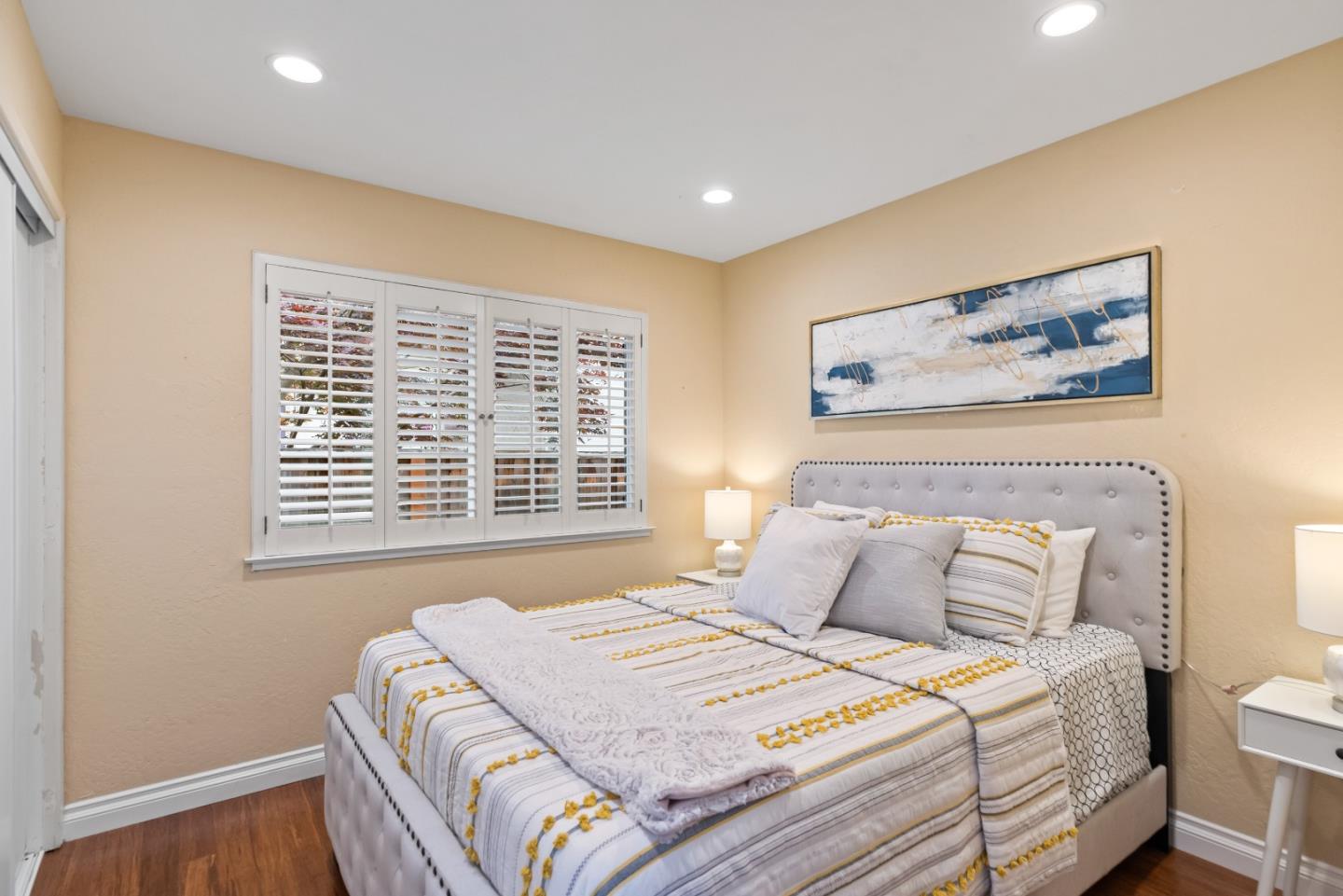 1110 Castleton Way Sunnyvale, CA 94087 - Photo 22 of 27 a bedroom with a bed and a painting on the wall