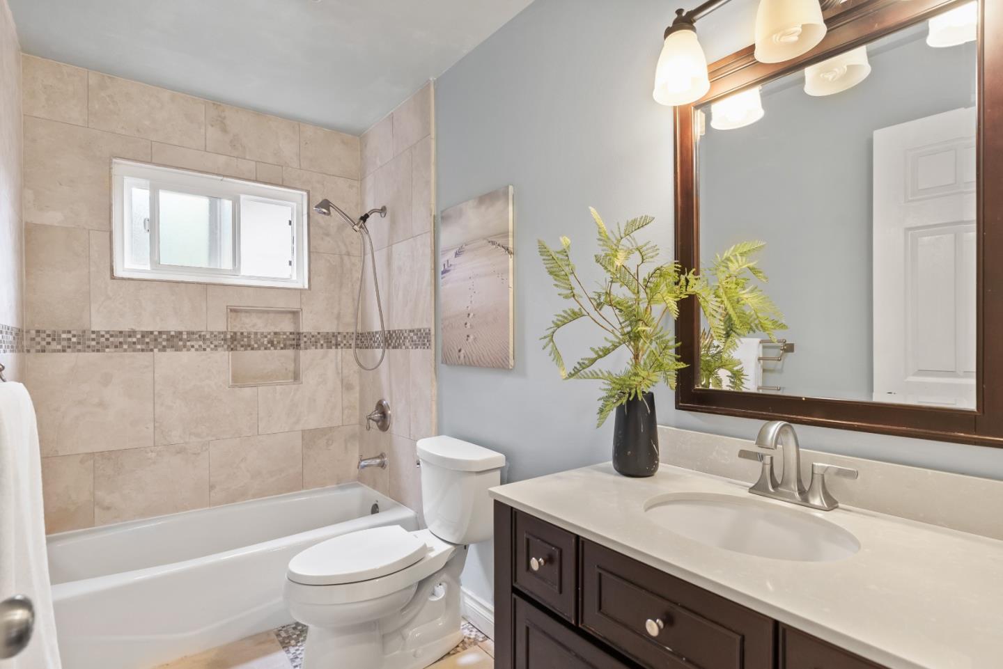 1110 Castleton Way Sunnyvale, CA 94087 - Photo 23 of 27 a bathroom with a granite countertop toilet a sink and a bathtub