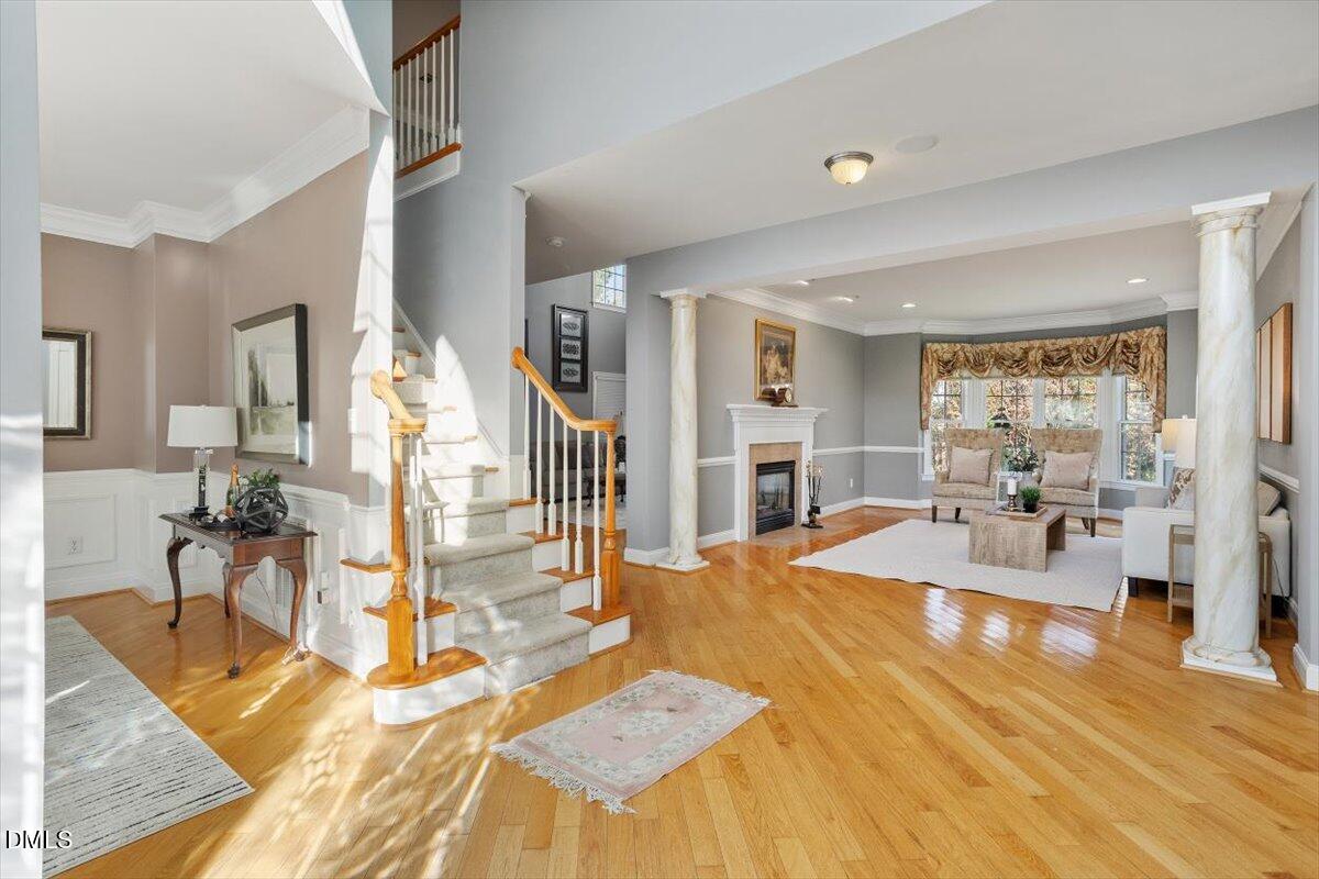 9120 Sanctuary Court Raleigh, NC 27617 - Photo 10 of 80 a room with table chairs and wooden floor