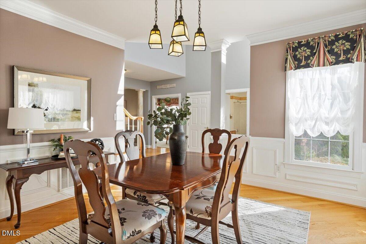 9120 Sanctuary Court Raleigh, NC 27617 - Photo 14 of 80 a dining room with furniture and window