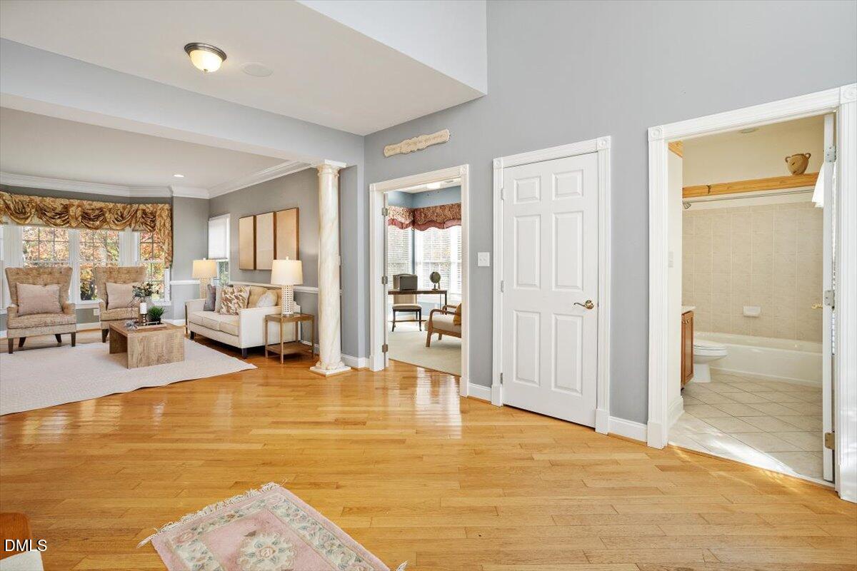 9120 Sanctuary Court Raleigh, NC 27617 - Photo 15 of 80 a view of a living room with furniture and floor to ceiling window