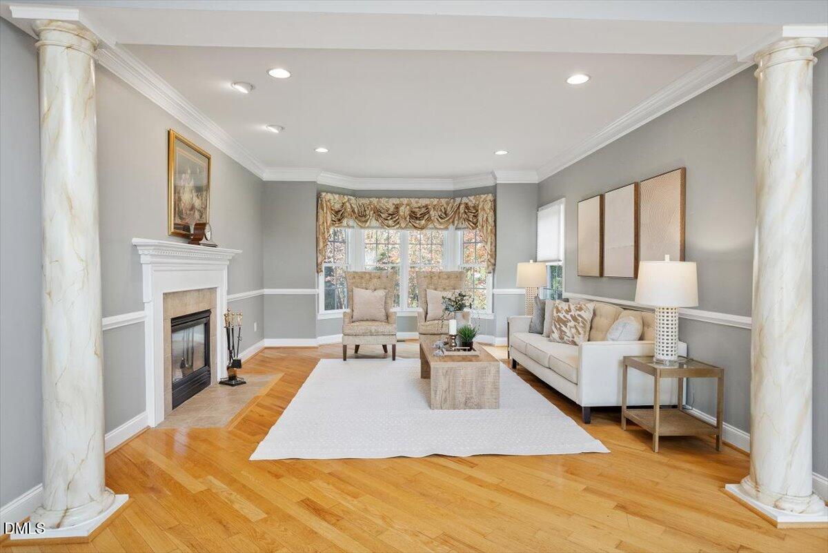 9120 Sanctuary Court Raleigh, NC 27617 - Photo 19 of 80 a living room with furniture fireplace and window