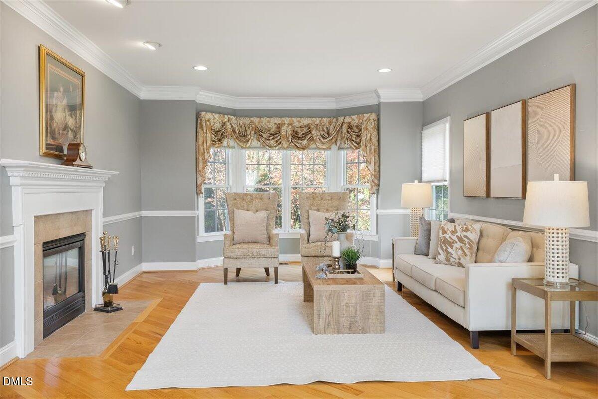 9120 Sanctuary Court Raleigh, NC 27617 - Photo 20 of 80 a living room with furniture and a fireplace