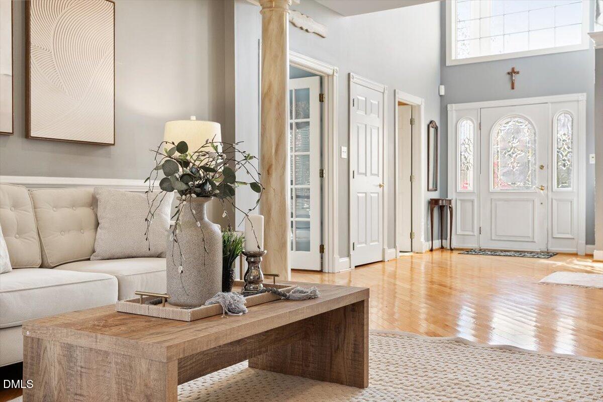 9120 Sanctuary Court Raleigh, NC 27617 - Photo 21 of 80 a living room with furniture and wooden floor
