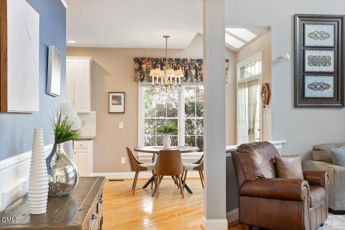 9120 Sanctuary Court Raleigh, NC 27617 - Photo 22 of 80 a living room with furniture and a large window