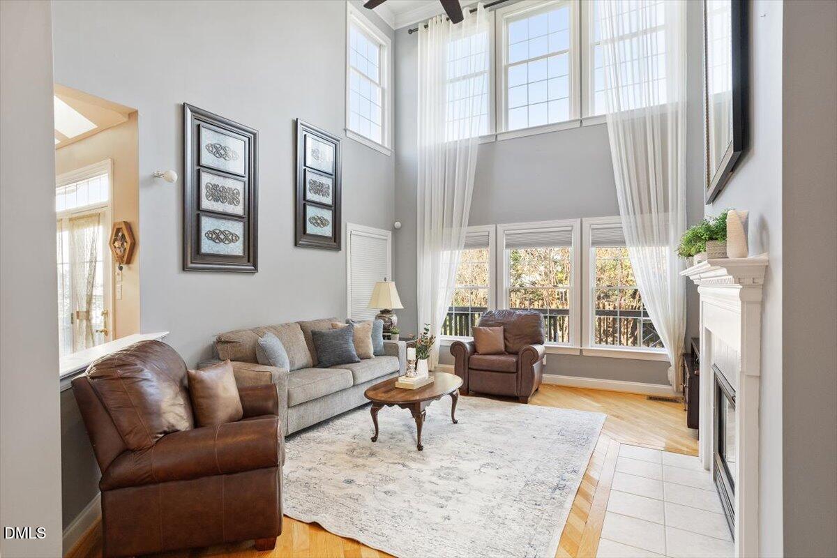 9120 Sanctuary Court Raleigh, NC 27617 - Photo 23 of 80 a living room with furniture and a large window