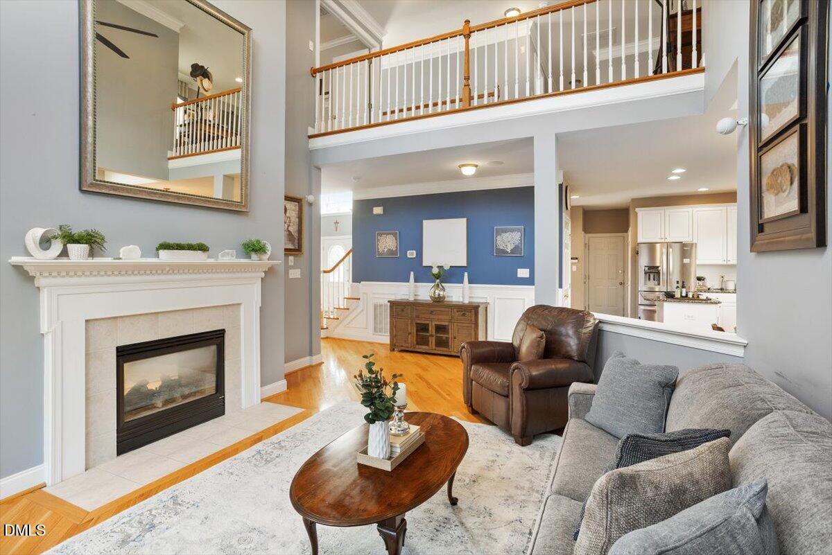9120 Sanctuary Court Raleigh, NC 27617 - Photo 24 of 80 a living room with furniture and a fireplace