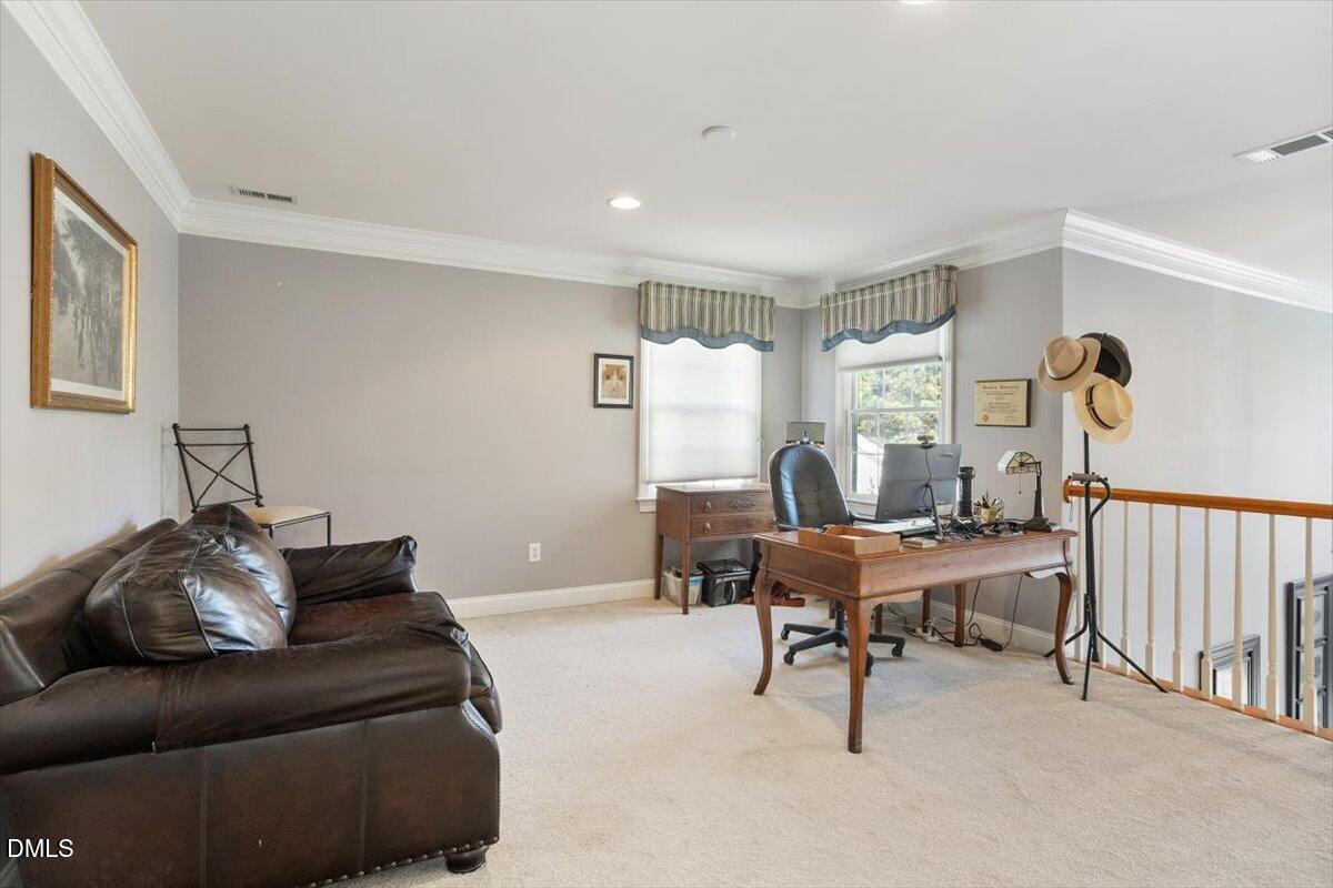 9120 Sanctuary Court Raleigh, NC 27617 - Photo 33 of 80 a living room with furniture and a large window