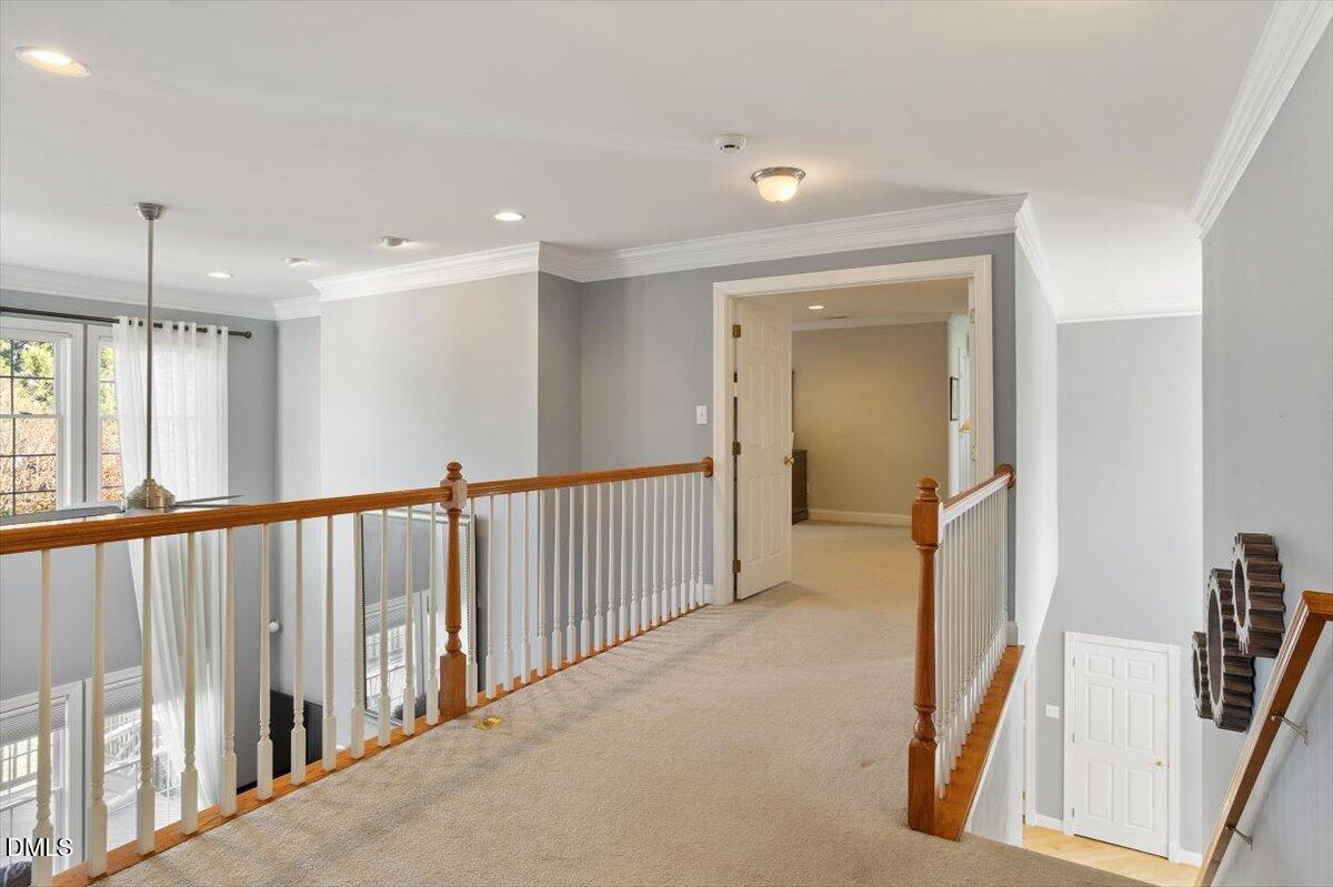 9120 Sanctuary Court Raleigh, NC 27617 - Photo 34 of 80 a view of a hallway with a livingroom and entryway