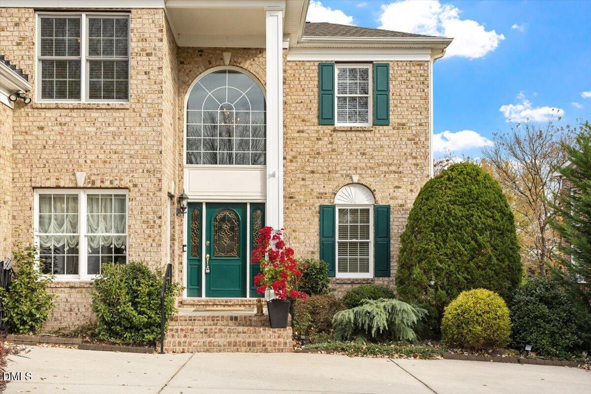 9120 Sanctuary Court Raleigh, NC 27617 - Photo 3 of 80 front view of a brick house with a yard