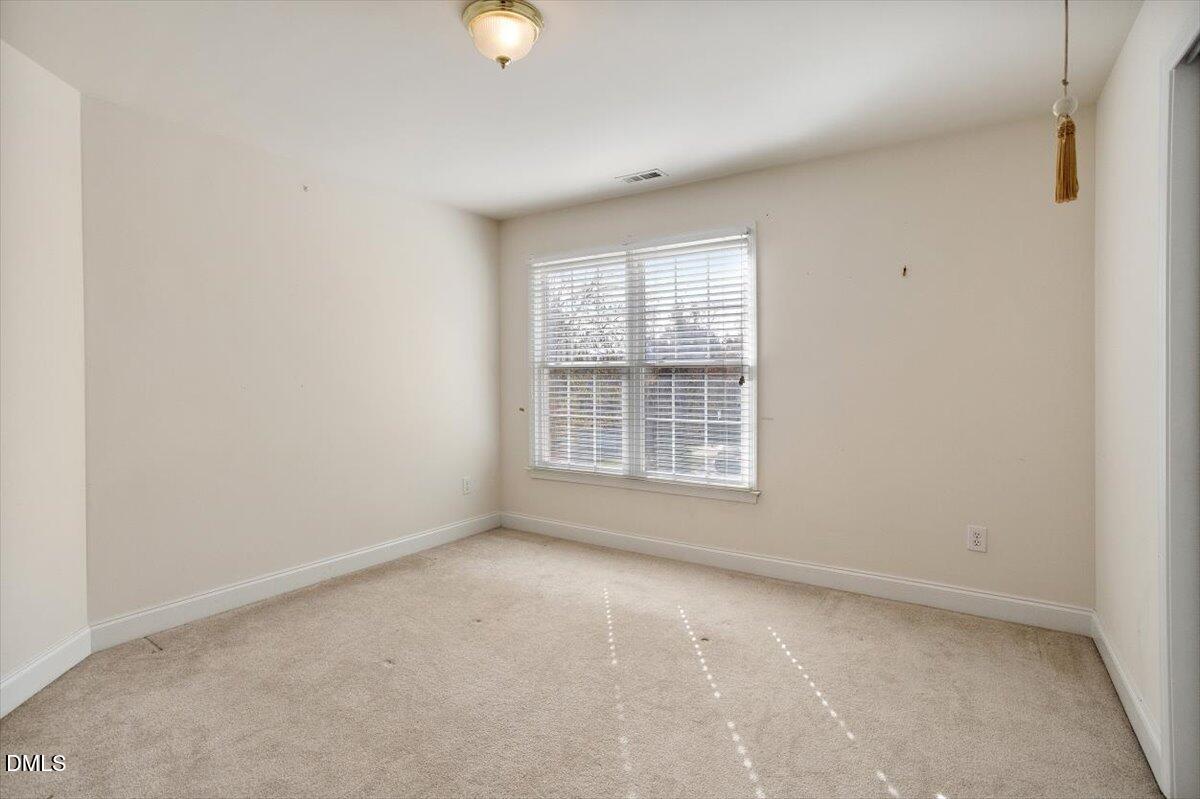 9120 Sanctuary Court Raleigh, NC 27617 - Photo 41 of 80 an empty room with a window
