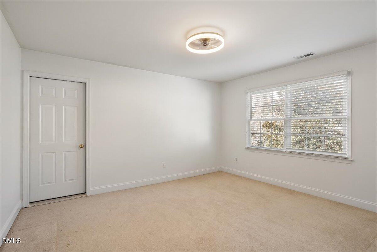 9120 Sanctuary Court Raleigh, NC 27617 - Photo 44 of 80 an empty room with a window