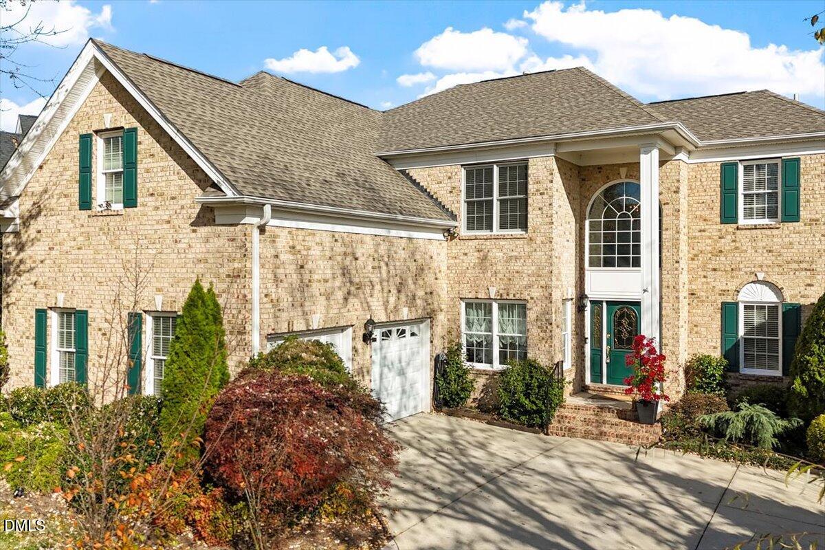 9120 Sanctuary Court Raleigh, NC 27617 - Photo 46 of 80 a view of a white house next to a yard