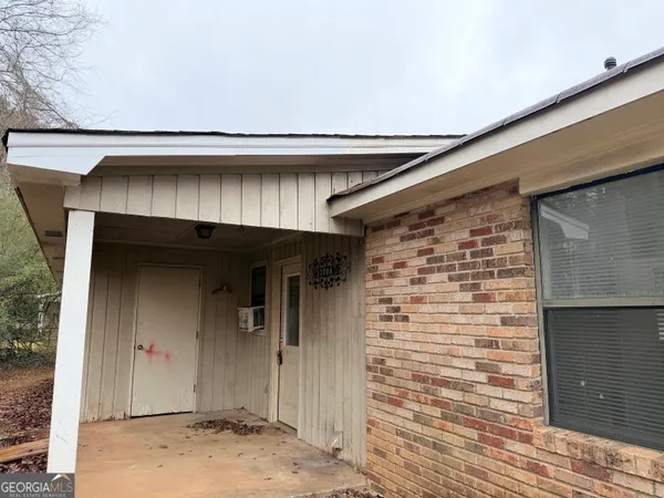 a front view of a house with an empty space