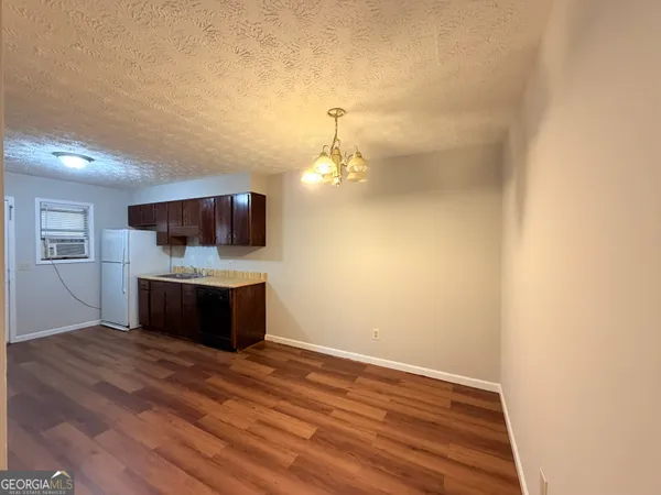 a view of a living room with flat screen tv