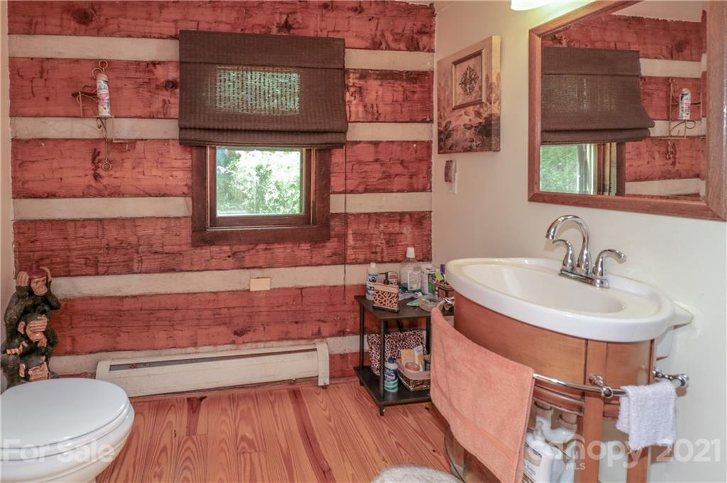 36 Maney Branch Road Weaverville, NC 28787 - Photo 19 of 42 a bathroom with a sink and a mirror