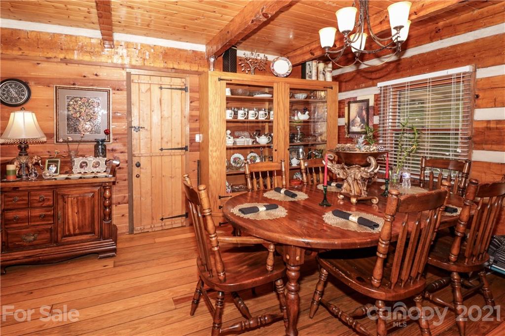 36 Maney Branch Road Weaverville, NC 28787 - Photo 3 of 42 a view of a dining room with furniture and wooden floor