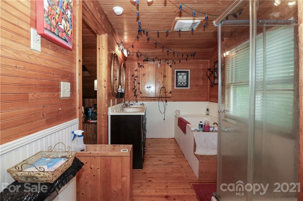 36 Maney Branch Road Weaverville, NC 28787 - Photo 30 of 42 a bathroom with a sink and a mirror