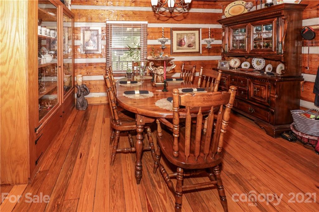 36 Maney Branch Road Weaverville, NC 28787 - Photo 4 of 42 a view of a chairs and table on the wooden floor