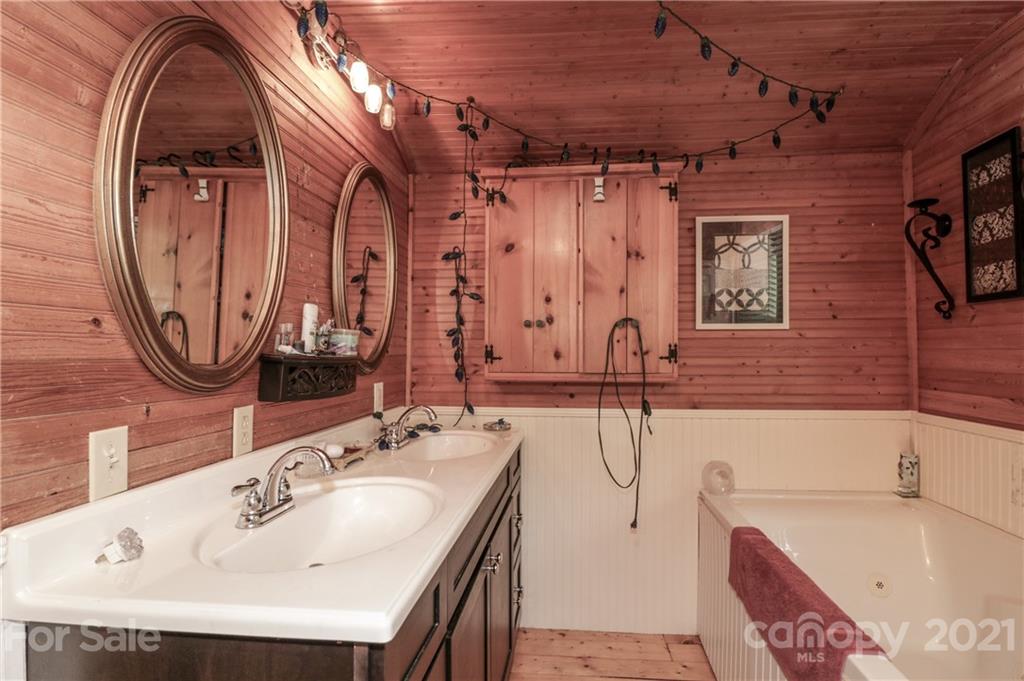 36 Maney Branch Road Weaverville, NC 28787 - Photo 31 of 42 a bathroom with a sink and a mirror