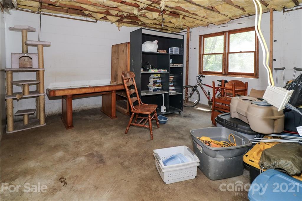 36 Maney Branch Road Weaverville, NC 28787 - Photo 40 of 42 a living room with furniture and a window