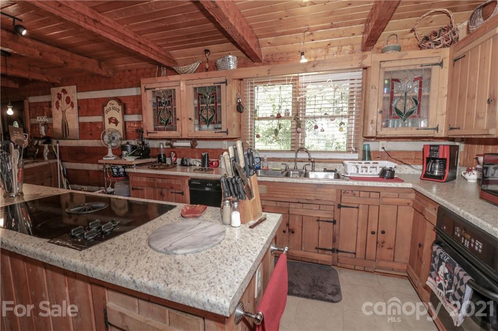36 Maney Branch Road Weaverville, NC 28787 - Photo 8 of 42 a kitchen with sink stove and cabinets