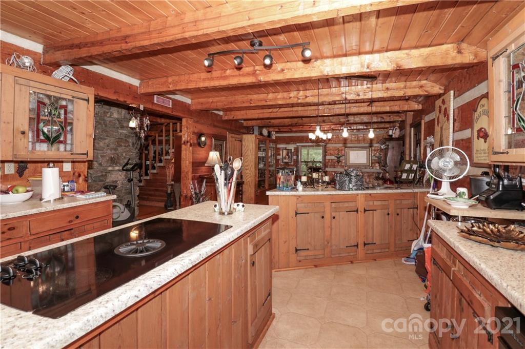 36 Maney Branch Road Weaverville, NC 28787 - Photo 9 of 42 a kitchen with stainless steel appliances granite countertop a sink and cabinets