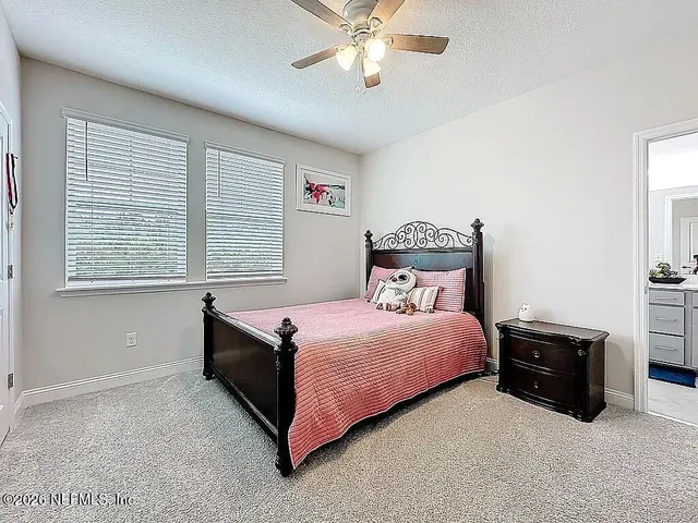 a view of a balcony with wooden floor and iron stairs