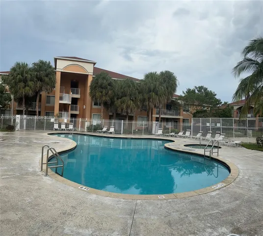 a view of a swimming pool with a patio