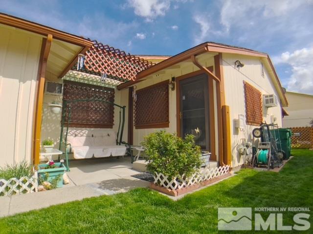 6570 Lotus Street Reno, NV 89506 - Photo 1 of 10 a front view of a house with garden