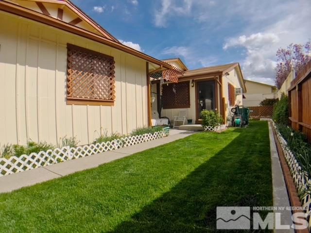 6570 Lotus Street Reno, NV 89506 - Photo 2 of 10 a front view of a house with a yard