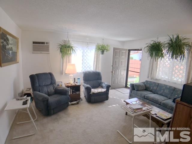 6570 Lotus Street Reno, NV 89506 - Photo 3 of 10 a living room with furniture and a large window