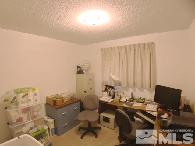 6570 Lotus Street Reno, NV 89506 - Photo 8 of 10 a view of a workspace with furniture