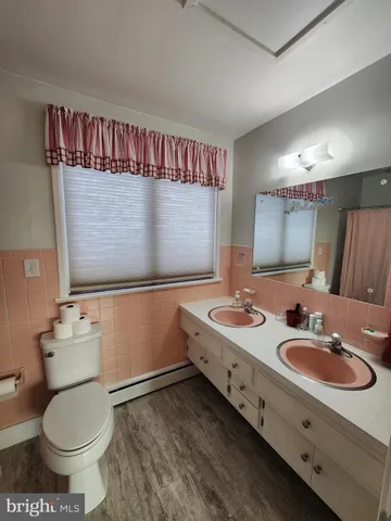 a view of a porch with a floor to ceiling window next to a yard