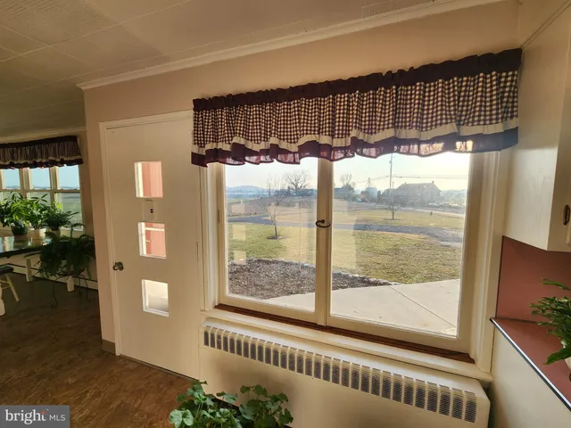 a kitchen with granite countertop a sink stainless steel appliances and cabinets