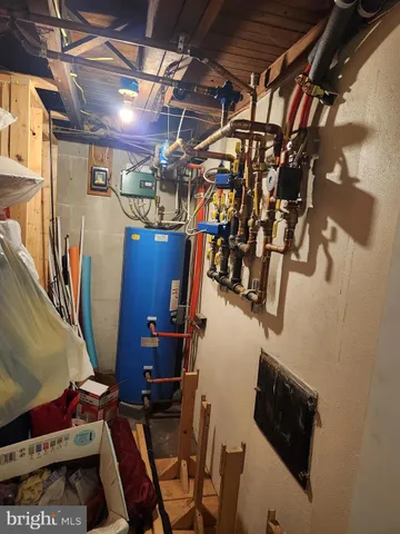 a large kitchen with stainless steel appliances granite countertop a stove a sink dishwasher and a refrigerator