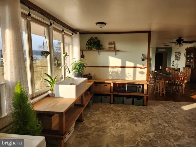 a bathroom with a toilet a sink and a mirror
