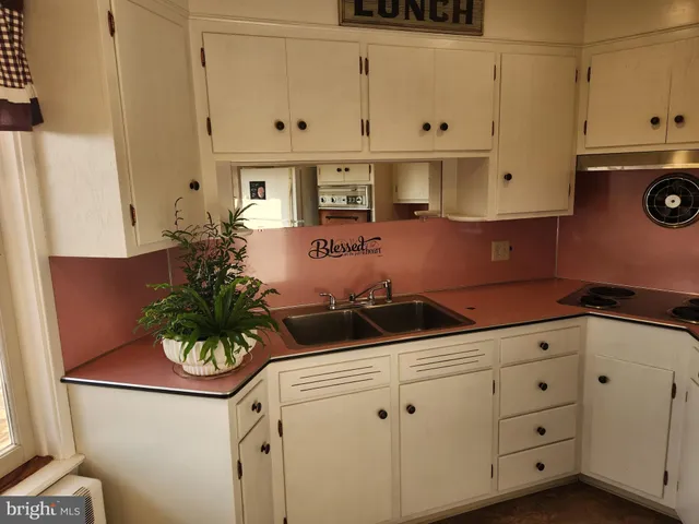 a view of a livingroom with furniture and a table