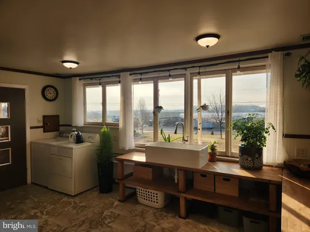a bathroom with a glass shower door and mirror