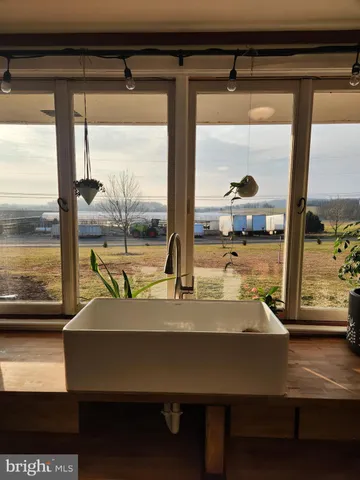 a bedroom that has a bed and a chandelier